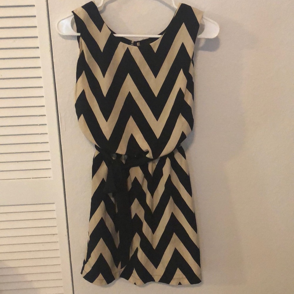 New without tag. Black and cream stripes with belt